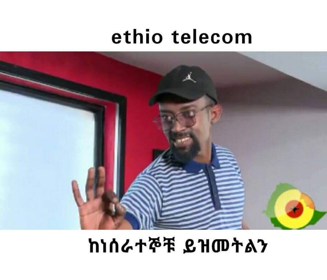 a man in a striped shirt and a black hat